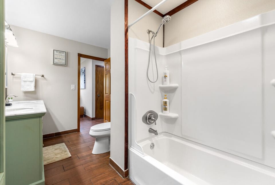 Bright bathroom with fresh towels and essentials provided