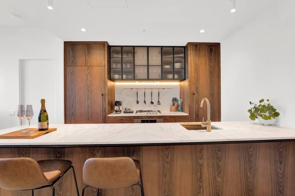 Gourmet kitchen with marble benchtops and gas cooktop