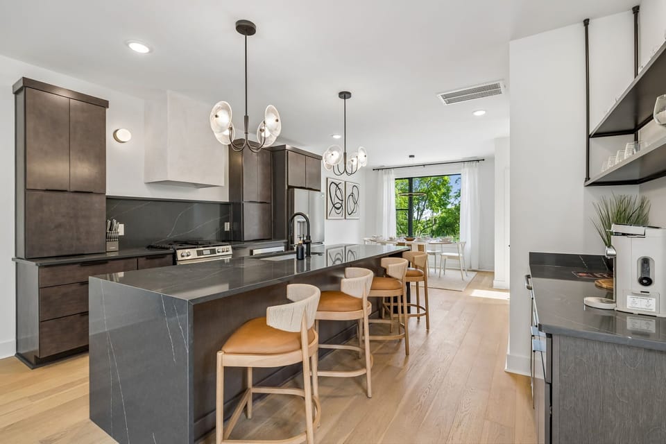 Kitchen: Fully equipped kitchen with modern appliances, sleek countertops, and ample space to cook and dine. Perfect for preparing home-cooked meals, morning coffee, or late-night snacks in a clean, stylish setting.