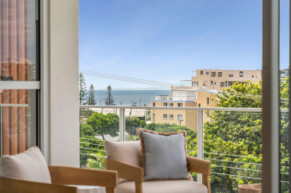Balcony with ocean views ideal for morning coffee or sunset drinks.