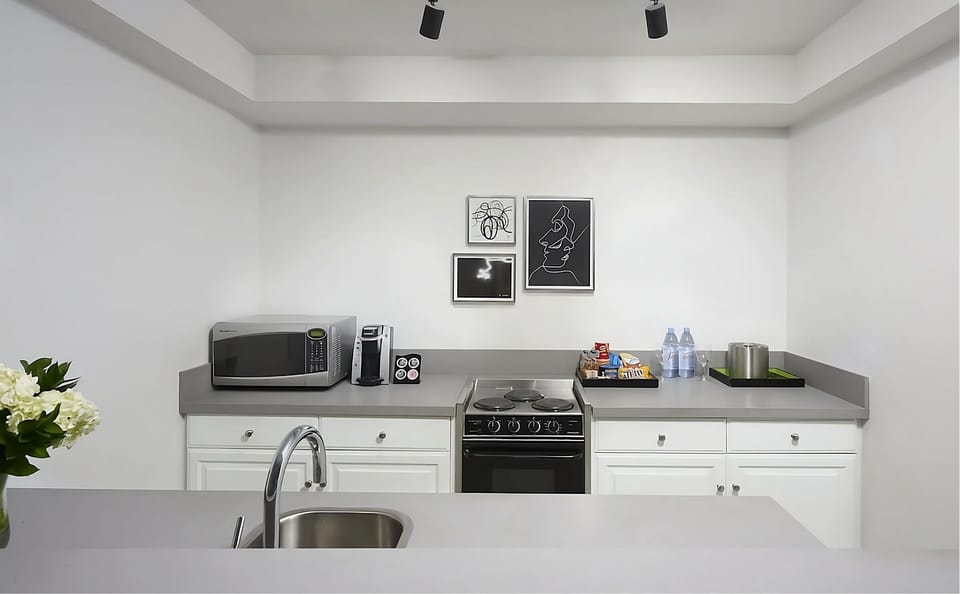 Cook easy meals with a full stove, sink, and microwave.