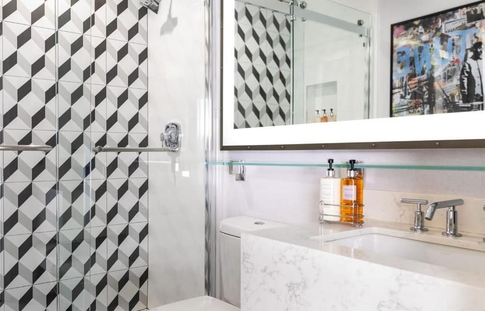 Refresh in a sleek glass shower with spa-like products.