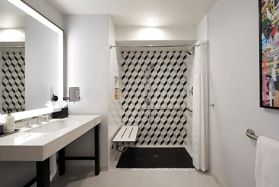 Refresh in a bright, accessible bathroom with walk-in shower.