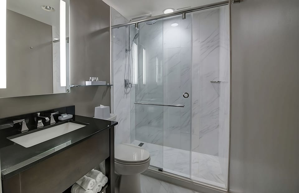 Refresh in a sleek glass shower with spa-like finishes.