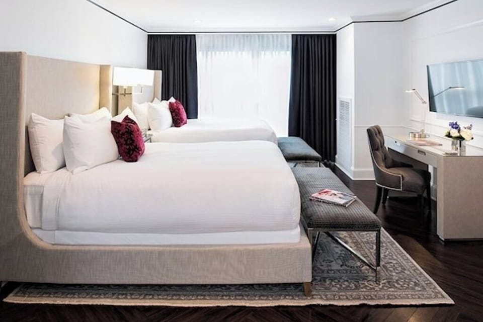 Unwind in a bright, spacious room with plush double beds.