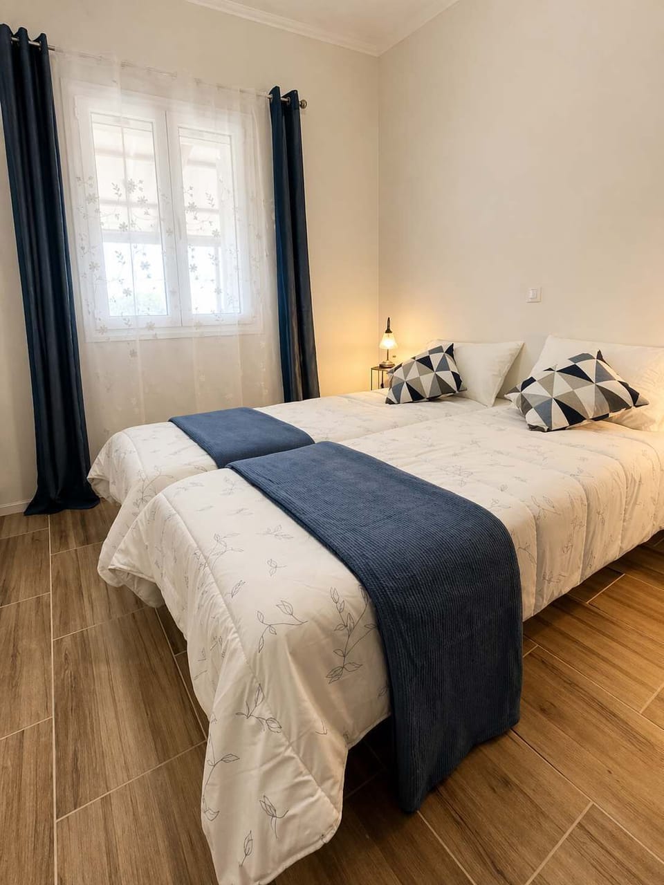Bedroom 2: with 2 single beds, offers a calm, uncluttered space with natural light, designed for a comfortable and quiet night’s sleep.