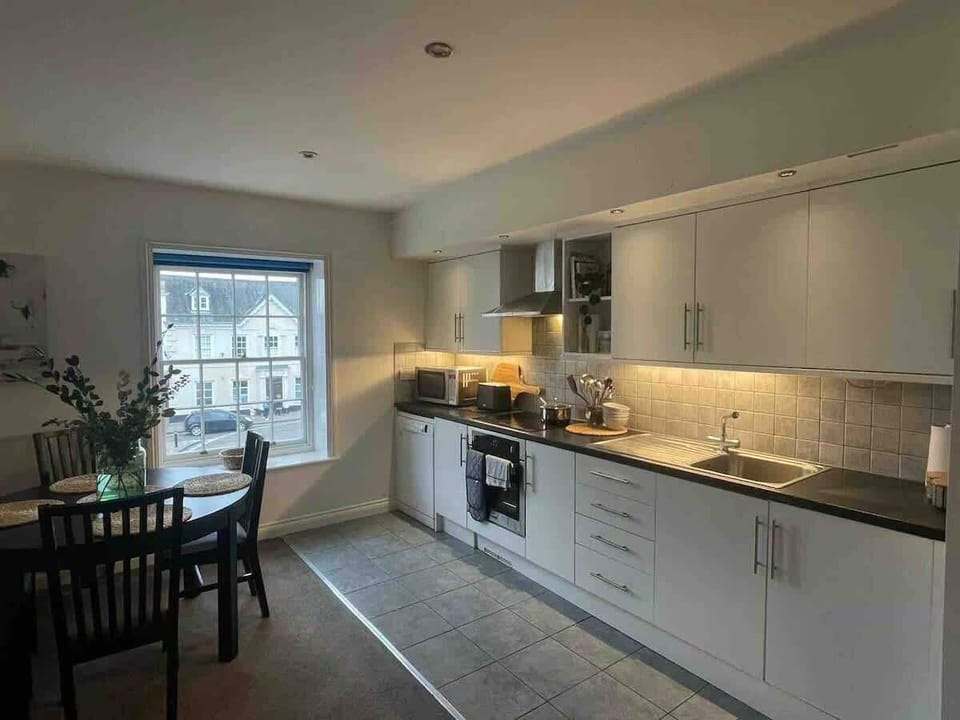 Fully equipped kitchen including microwave, hob and stove. 