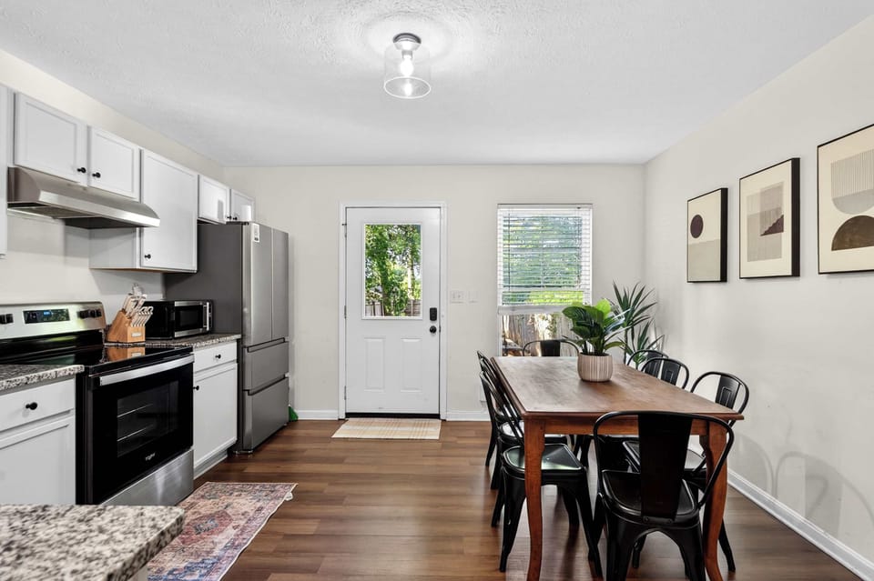 Dining Area: Gather around in this inviting dining area, perfect for enjoying meals, morning coffee, or meaningful conversations with family and friends during your stay.