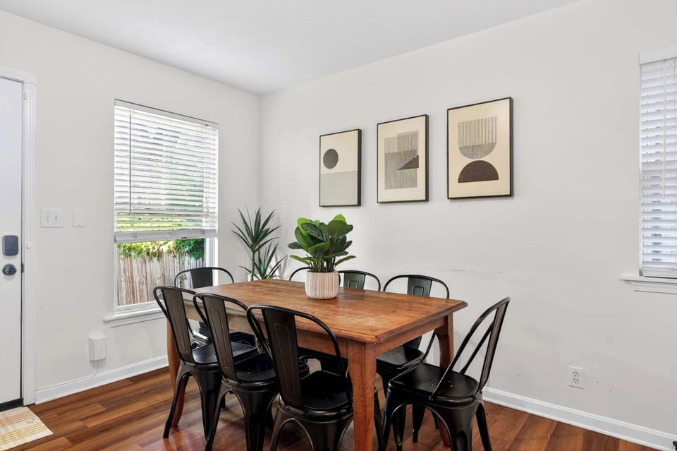 Dining Area: Gather around in this inviting dining area, perfect for enjoying meals, morning coffee, or meaningful conversations with family and friends during your stay.