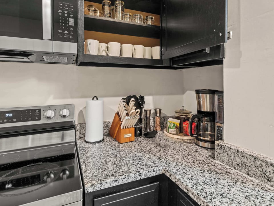 Kitchen: Whether you're preparing a quick snack or a full dinner, this spacious kitchen offers everything you need in a bright and welcoming space.