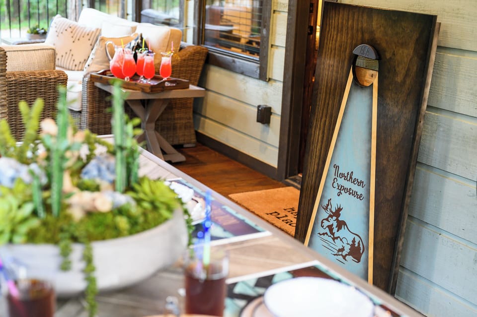 Your private patio offers cozy wicker seating and refreshing drinks awaiting your arrival, with charming local touches.