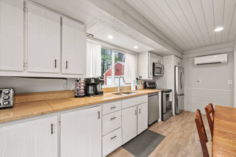 Fully equipped kitchen with modern appliances and generous counter space—perfect for preparing meals with ease.