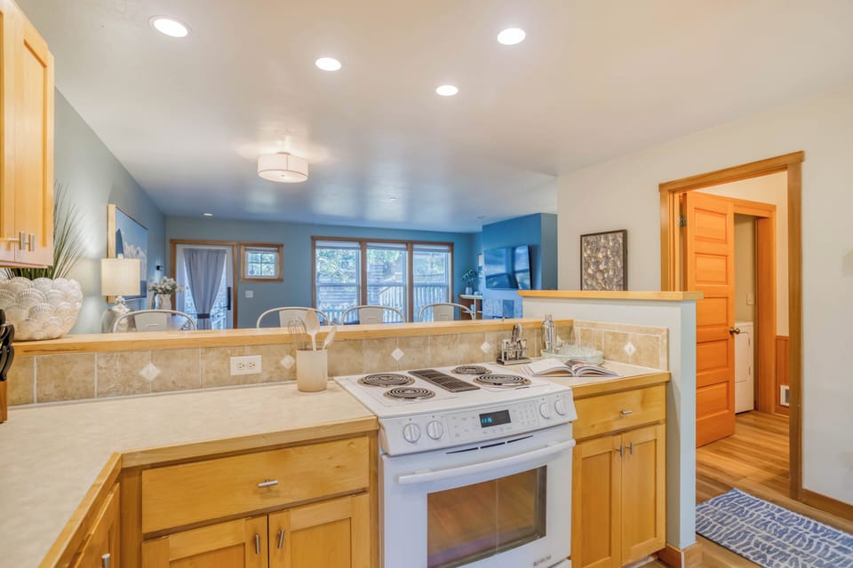Your open kitchen flows seamlessly into the dining and living areas, perfect for gathering with loved ones while preparing meals.
