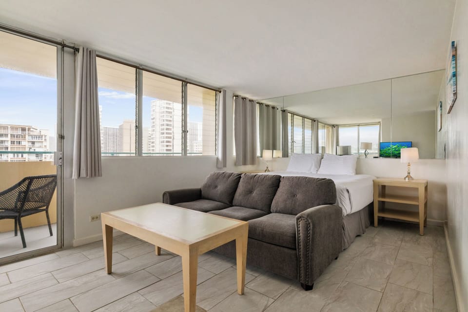 You'll love this bright studio with city views and comfortable seating. Floor-to-ceiling windows flood the space with natural light.