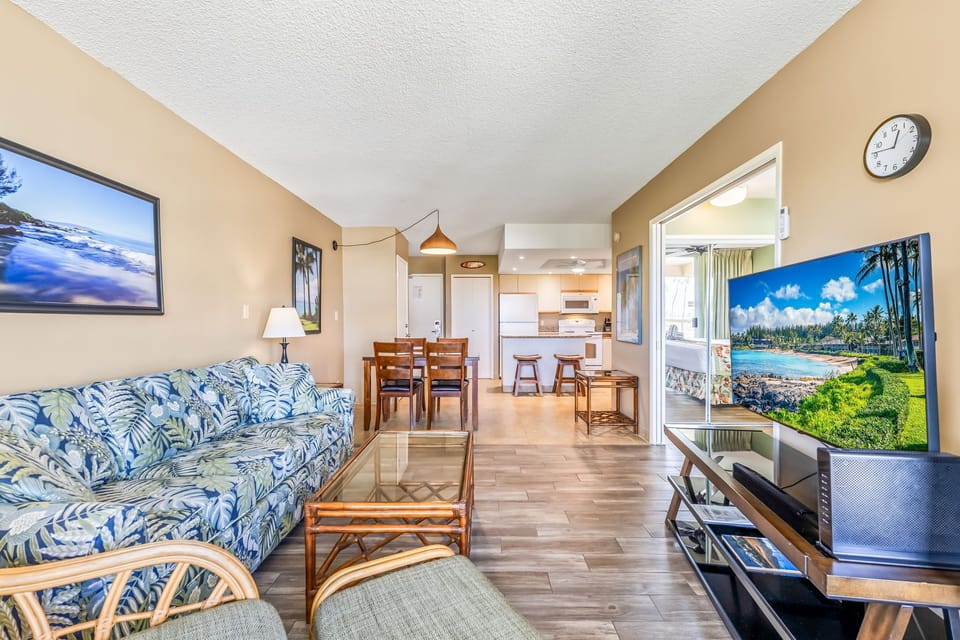 Relax in this bright, open living space with coastal charm and tropical decor. Enjoy seamless flow from your cozy living room to a well-equipped kitchen and inviting balcony with stunning views.