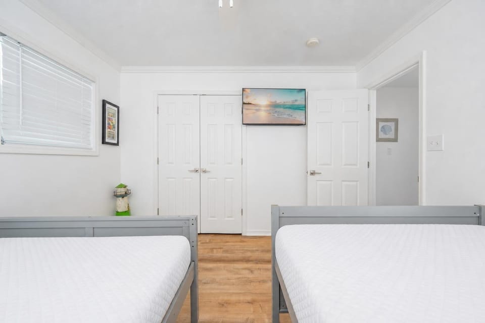 Double beds in the guest suite invite restful nights after a day of adventures along the coast