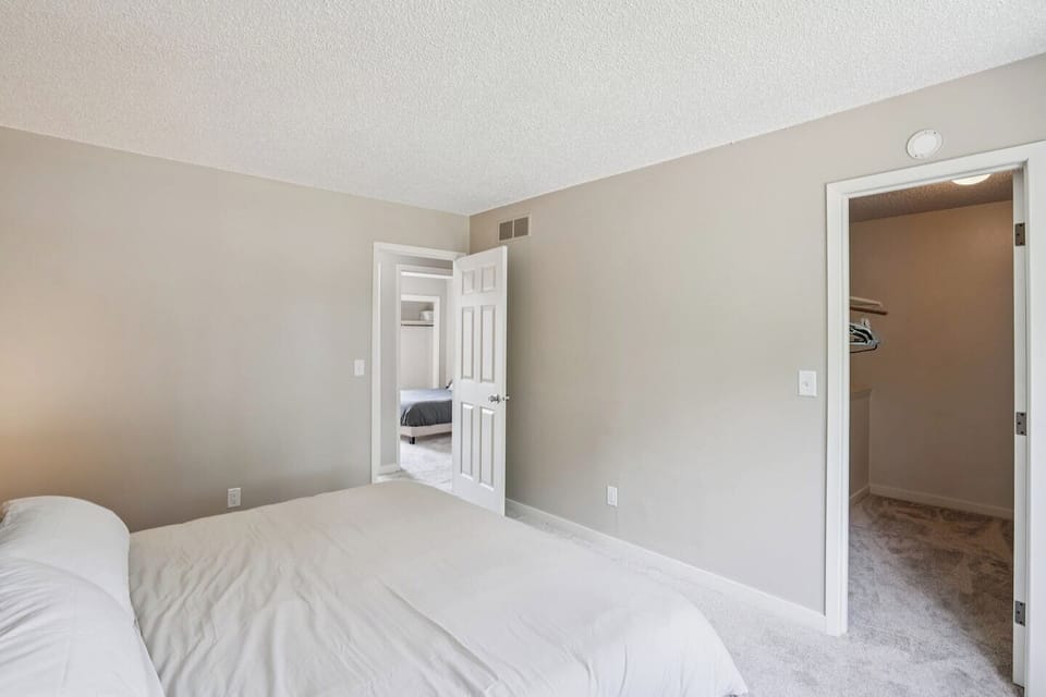 King Bed | Unit 2 | Top Floor
A king bed sleeps two guests. A closet with hanging space located in the room. Access to a shared full bathroom on the same floor.