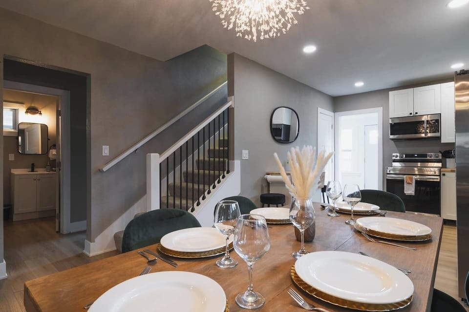 A sleek and modern kitchen flows into the dining area, with stylish details and an open feel.