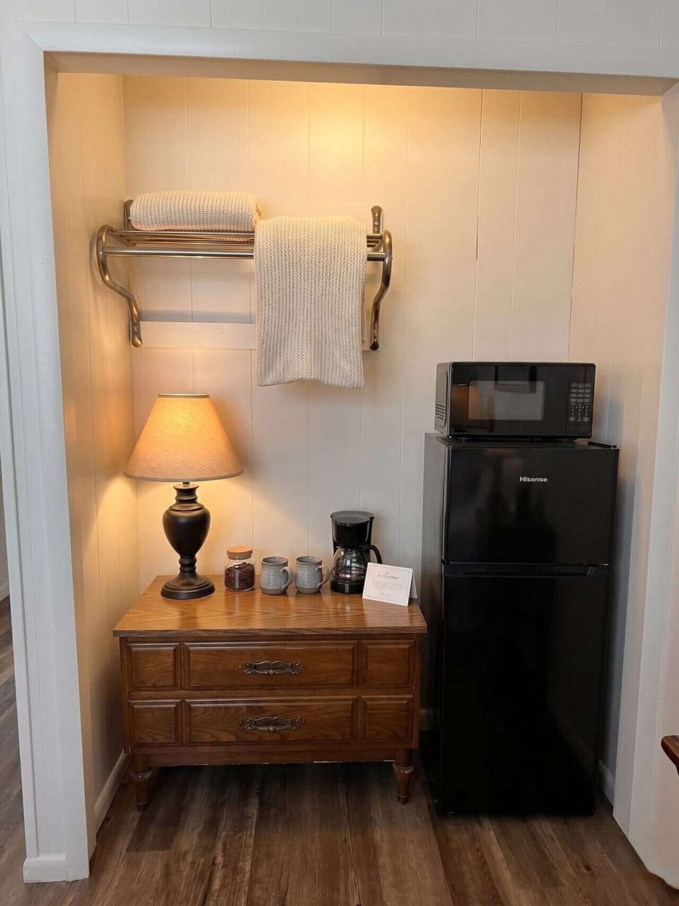 In-room kitchenette with mini-fridge, microwave, and coffee maker — perfect for slow mornings before a day on Sandusky Bay.