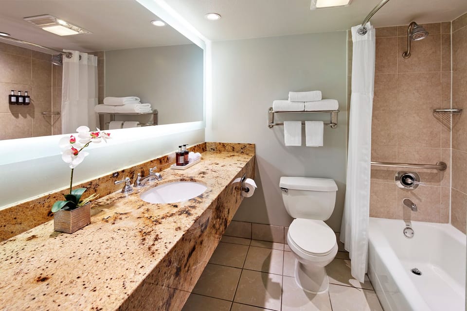 Refresh easily in a bright bathroom with spacious vanity.