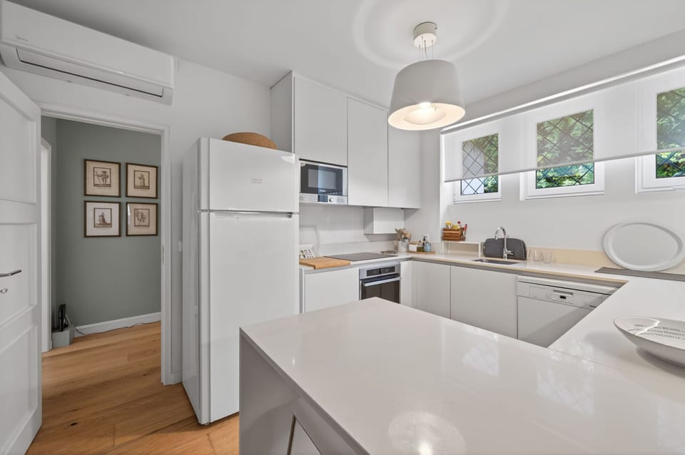 Kitchen with laundry and pantry — Villa Natura, holiday villa with fenced private pool in Colares, Sintra