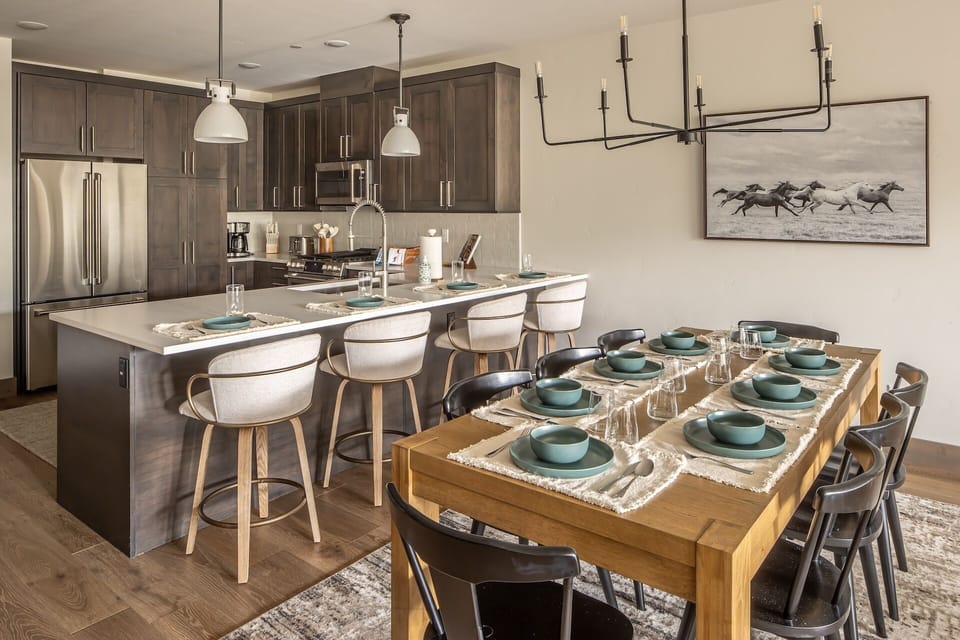 Your modern kitchen flows seamlessly into the dining space, where you'll create memorable meals with premium appliances and gather around the stylish table for intimate dinners.