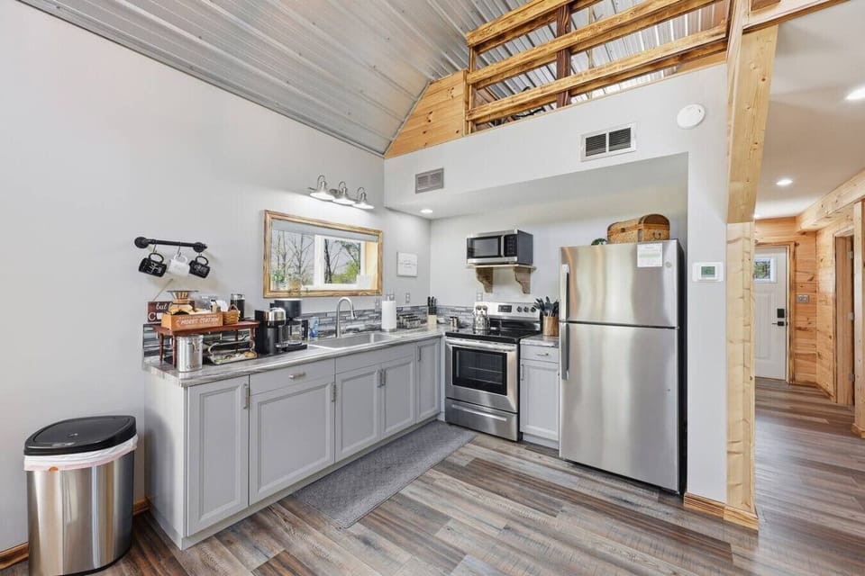 Modern kitchen with full-size appliances and vaulted ceiling