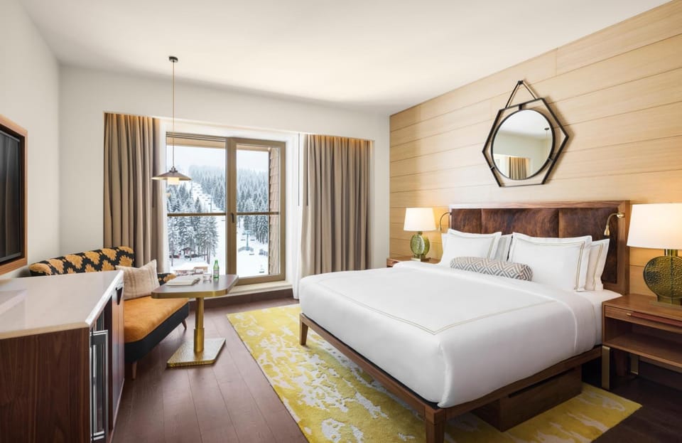 Cozy up by the window while snowy peaks fill the view.