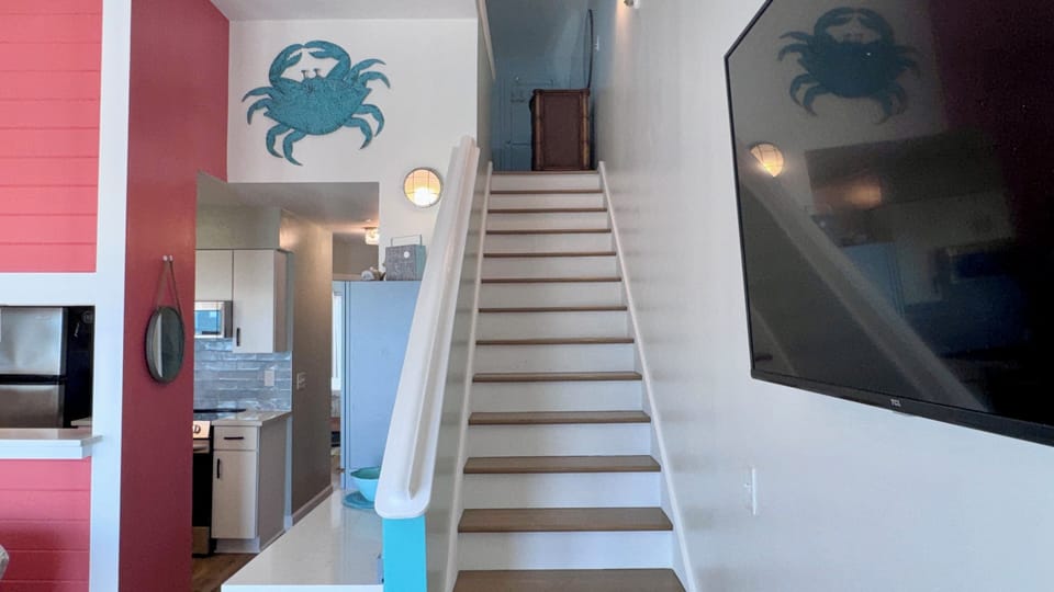 Stairs to lofted queen bedroom