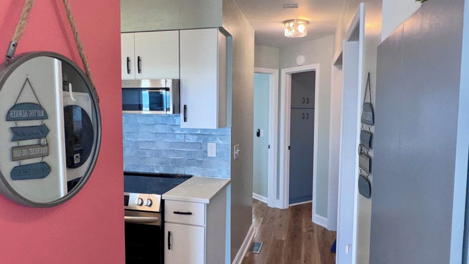 Hallway to laundry, bunks, bathroom & king bedroom