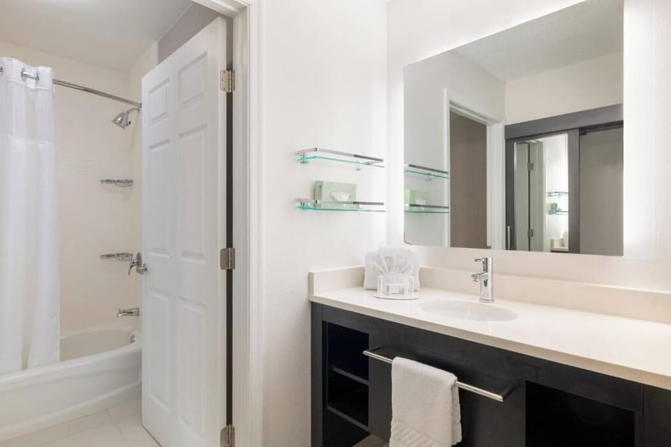 Refresh easily in a bright bathroom with tub-shower combo.