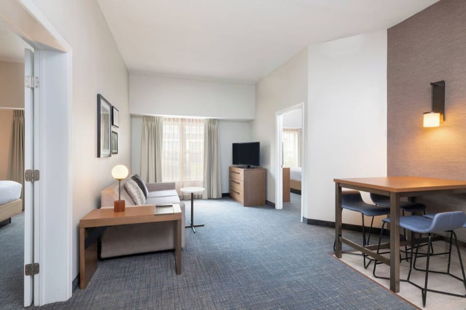 Unwind in a spacious suite with lounge and dining comfort.