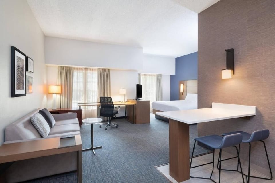 Gather in the spacious suite with lounge seating and dining.
