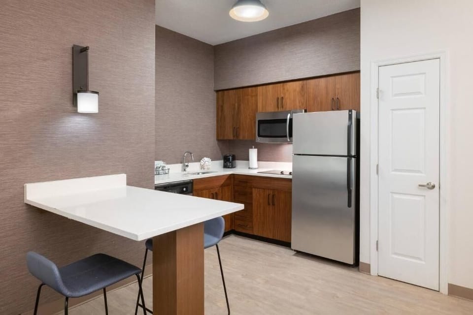 Enjoy simple dining moments with a modern kitchenette setup.