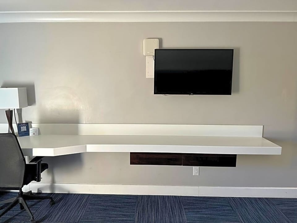 Catch up on emails at the dedicated desk workspace.