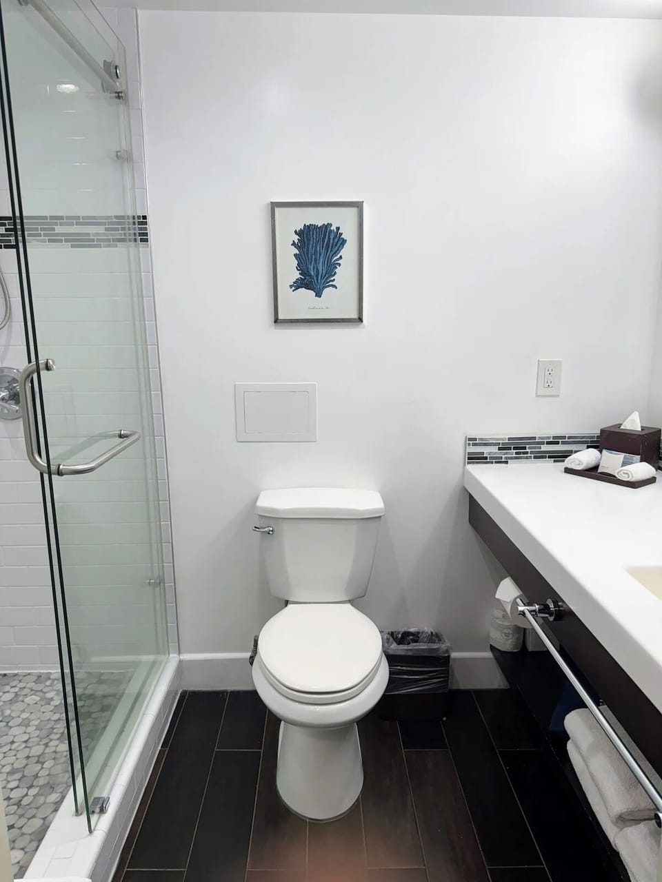 Refresh in a spotless bathroom with a sleek glass shower.