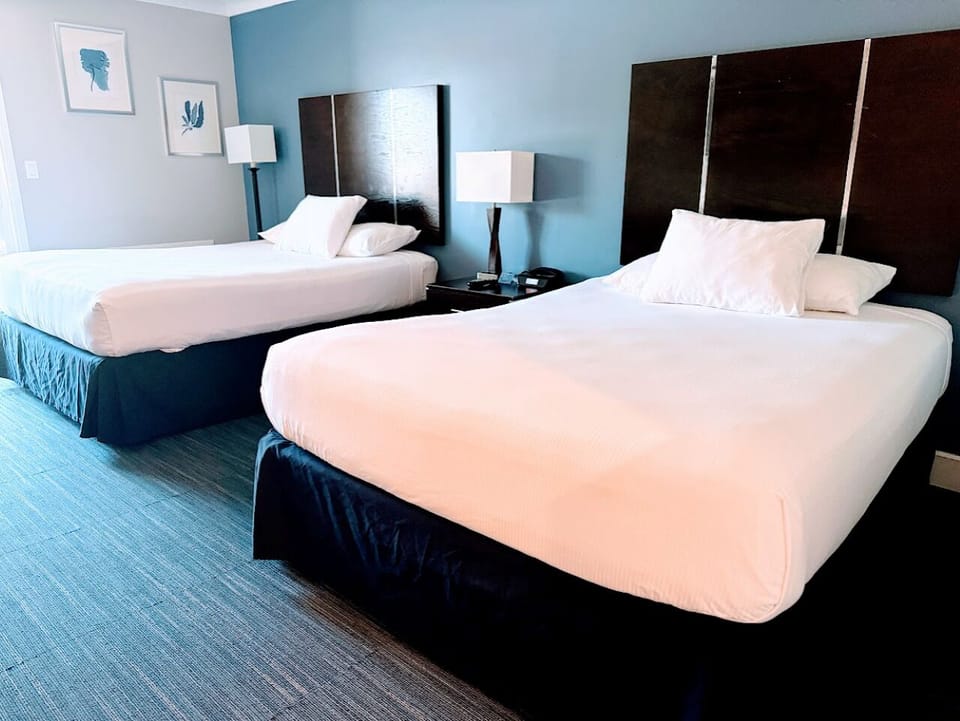Unwind in crisp double-queen comfort after a busy day.