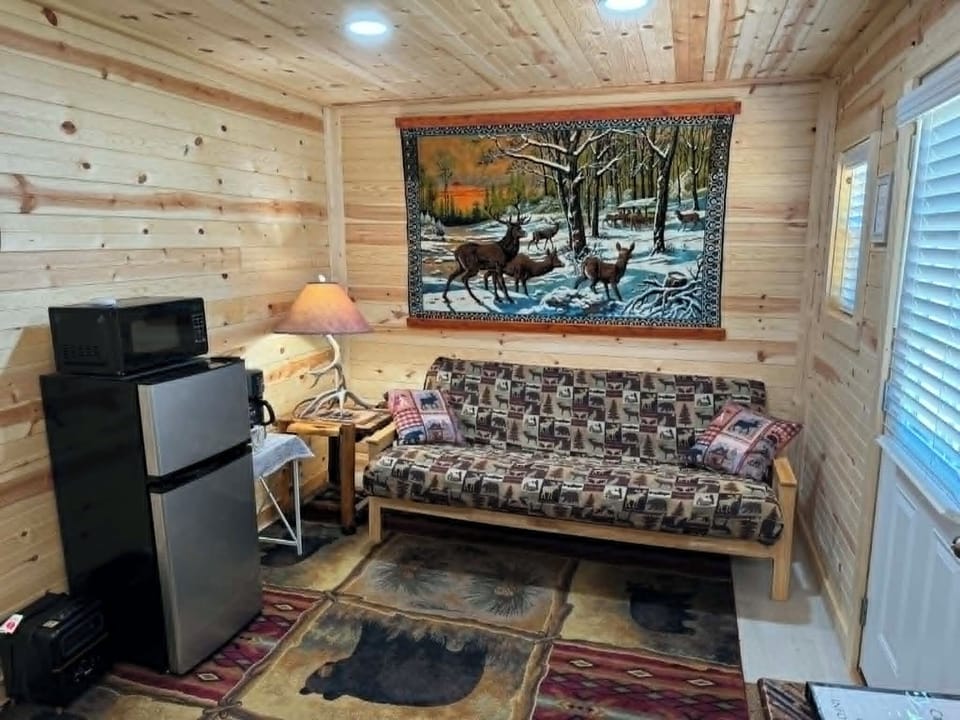 Futon with full size mattress, mini fridge, microwave, and coffee maker