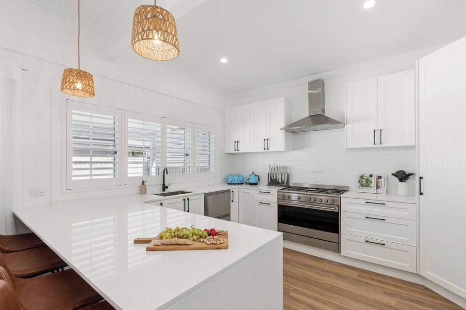 Pull up a stool at the breakfast bar, the perfect spot to chat, sip, and keep the cook company.