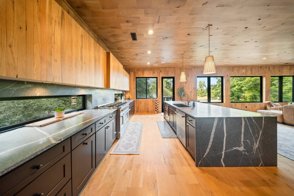Large, chef's grade appliances in the fully stocked kitchen.