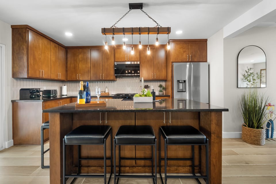 Fully stocked kitchen with full-size appliances, cookware, and dishes for 8.