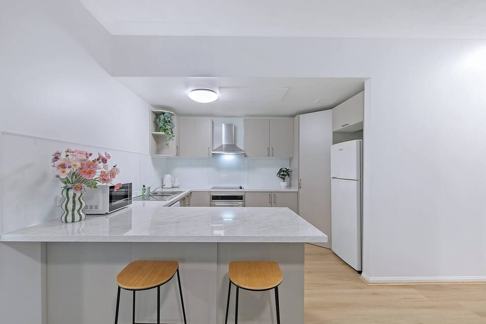 Start your morning at the breakfast bar, a casual spot for coffee before heading out to explore nearby riverside paths.