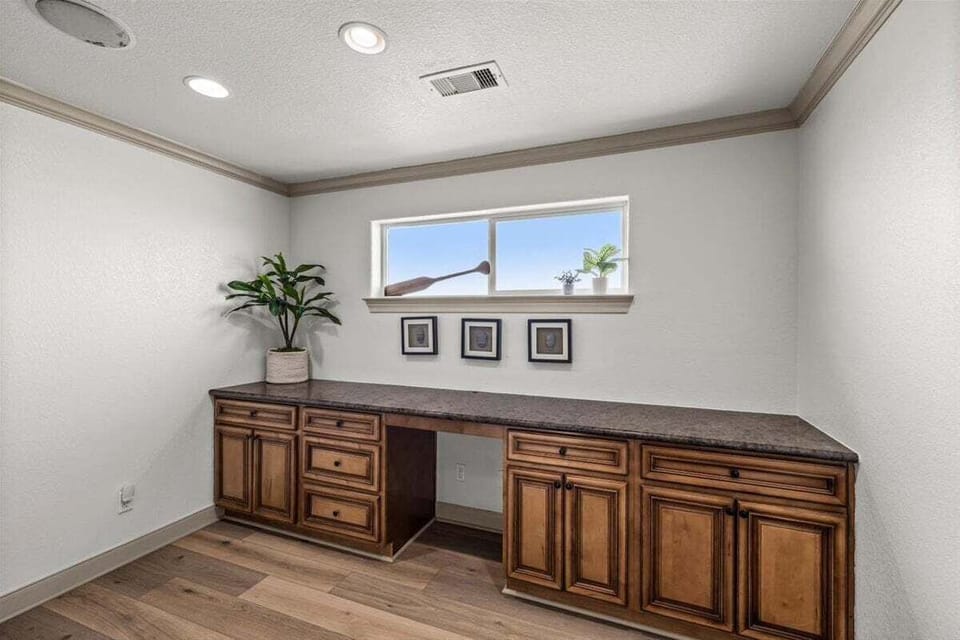 Room with long cabinetry – extra storage space in beach vacation home
