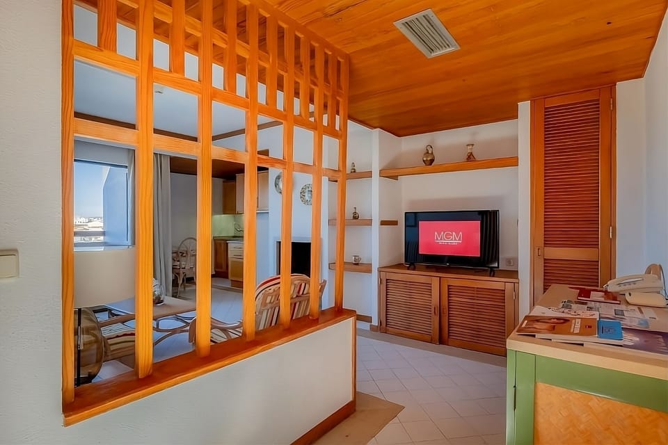Kick back in the lounge area with TV and handy storage.