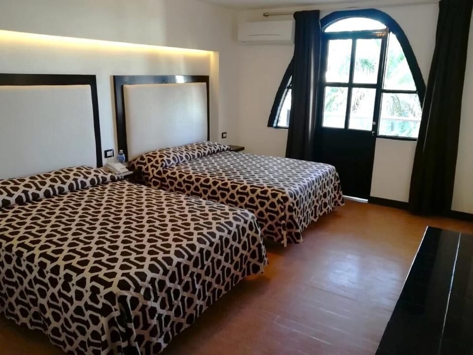 Wake up to daylight by the window in a spacious room.