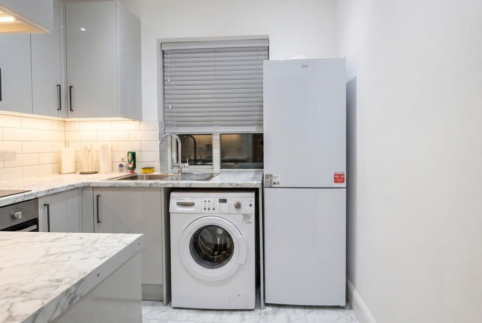 Kitchen with Bosch dishwasher, washing machine and tall fridge so longer stays stay effortlessly comfortable.