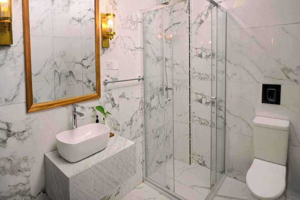 Unwind with a spa-like shower in crisp marble surroundings.