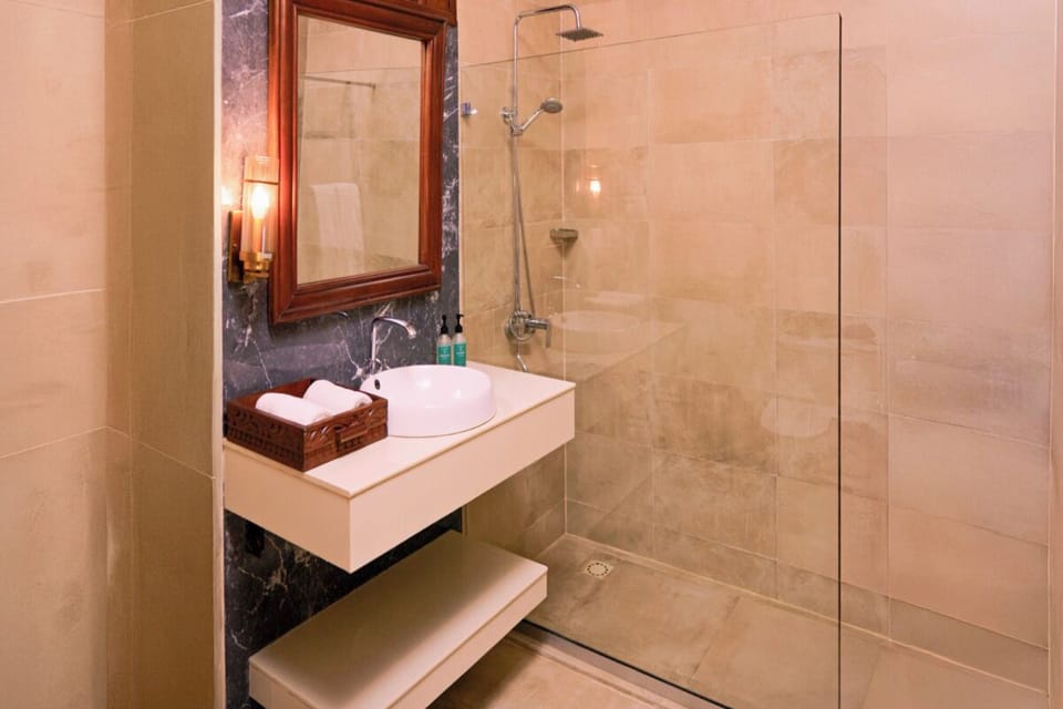 Step into a calming rainfall shower after a day out.