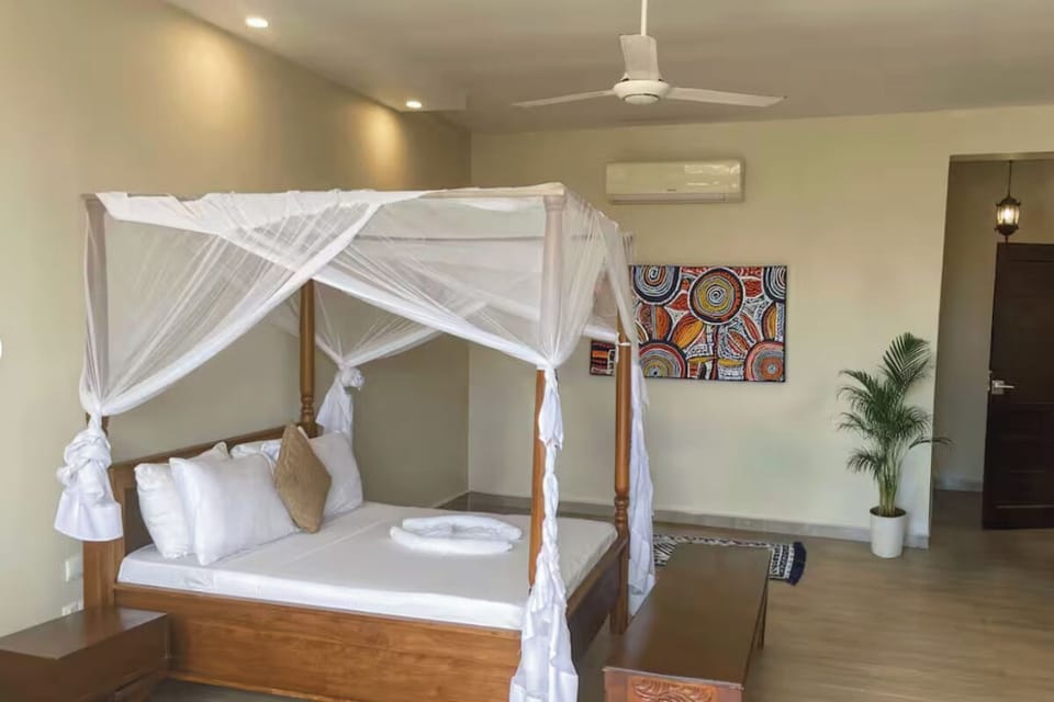 Stretch out in an airy canopy room with cool AC comfort.