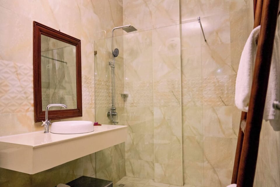 Rinse off in a bright, spacious shower with modern finishes.